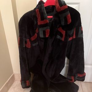 Real fur coat. Mainly Purple with rust/green modern colored pattern. Knee length